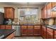 This kitchen features granite countertops, stainless steel appliances, and wood cabinets at 4012 Grand Park Ne Dr, Suwanee, GA 30024