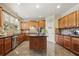 Well-equipped kitchen with stainless steel appliances, granite countertops, and a center island at 4012 Grand Park Ne Dr, Suwanee, GA 30024