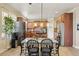 Charming kitchen features wood cabinets, stainless steel appliances, and a cozy dining area at 4012 Grand Park Ne Dr, Suwanee, GA 30024