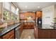 Beautiful kitchen featuring granite countertops, stainless appliances, tile backsplash, and wood cabinets at 4012 Grand Park Ne Dr, Suwanee, GA 30024