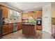 Well-equipped kitchen with stainless steel appliances, granite countertops, and a center island at 4012 Grand Park Ne Dr, Suwanee, GA 30024