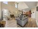 Spacious living room with high ceilings, stone fireplace, and open floor plan to kitchen at 4012 Grand Park Ne Dr, Suwanee, GA 30024