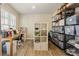 Bright home office with lots of natural light, shelving, and modern desk at 4012 Grand Park Ne Dr, Suwanee, GA 30024