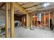 Unfinished basement showcasing wood framing and open space, ready for customization at 4249 Caveat Ct, Fairburn, GA 30213