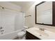 Standard bathroom with a shower-tub combo and a vanity with a large mirror at 4249 Caveat Ct, Fairburn, GA 30213