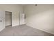Neutral bedroom featuring a closet and white doors at 4249 Caveat Ct, Fairburn, GA 30213