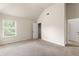 Bright bedroom featuring a window with blinds and neutral carpeting at 4249 Caveat Ct, Fairburn, GA 30213