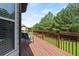 Wooden deck provides a serene outdoor space overlooking the lush backyard at 4249 Caveat Ct, Fairburn, GA 30213