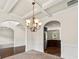 Elegant dining room with decorative lighting, arched doorways and detailed trimwork at 4249 Caveat Ct, Fairburn, GA 30213