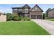 Beautiful brick home with green lawn and a two-car garage at 4249 Caveat Ct, Fairburn, GA 30213