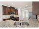Modern kitchen boasts granite counters, stainless appliances, and ample cabinet space at 4249 Caveat Ct, Fairburn, GA 30213