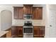 Updated kitchen features stainless steel appliances, granite countertops, and ample cabinet storage at 4249 Caveat Ct, Fairburn, GA 30213