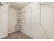 Walk-in closet boasting white wire shelving and drawers to maximize storage space at 4249 Caveat Ct, Fairburn, GA 30213
