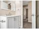 Stylish bathroom with a white vanity, modern fixtures, and neutral wall color at 5257 Orly Ter, Atlanta, GA 30349