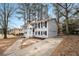 Charming two-story home with black shutters and a large concrete driveway at 5257 Orly Ter, Atlanta, GA 30349