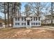 Charming two-story home features black shutters and a well-manicured front yard at 5257 Orly Ter, Atlanta, GA 30349