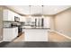 Modern kitchen featuring stainless steel appliances and a granite countertop island at 5257 Orly Ter, Atlanta, GA 30349