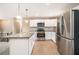 Bright kitchen with stainless steel appliances, granite countertops, and tiled backsplash at 5257 Orly Ter, Atlanta, GA 30349