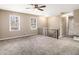 Spacious living room with neutral carpeting and large windows at 5257 Orly Ter, Atlanta, GA 30349