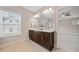 Bathroom featuring a double vanity with granite counters and view to bedroom at 2625 Draw Dr, Marietta, GA 30066