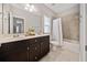 Bathroom featuring double sinks, generous cabinet storage, and shower/tub combo at 2625 Draw Dr, Marietta, GA 30066