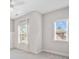 Bright bedroom with large windows, modern ceiling fan, and stylish shiplap accent wall at 2625 Draw Dr, Marietta, GA 30066