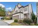 A home with a two-car garage, and a well-manicured lawn at 2625 Draw Dr, Marietta, GA 30066