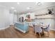 Bright kitchen boasts stainless appliances, an island with seating, and rustic shelves perfect for any chef at 2625 Draw Dr, Marietta, GA 30066