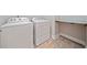 Functional laundry area with washer, dryer, and shelving ready for your laundry needs at 2625 Draw Dr, Marietta, GA 30066