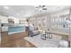 Open-concept living room flows into a bright kitchen, hardwood floors and modern decor at 2625 Draw Dr, Marietta, GA 30066