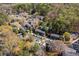 Aerial view showcasing garden style apartment community nestled in wooded area with pool at 765 Houston Mill Ne Rd # 7, Atlanta, GA 30329