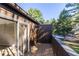 View of the private balcony with sliding glass door, exterior wood details, and view to common ground at 765 Houston Mill Ne Rd # 7, Atlanta, GA 30329