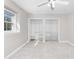 A bedroom featuring a large window and walk-in closets with adjustable shelves at 765 Houston Mill Ne Rd # 7, Atlanta, GA 30329