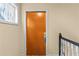 Apartment unit door in a hallway with a small window and a staircase at 765 Houston Mill Ne Rd # 7, Atlanta, GA 30329