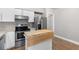 Modern kitchen featuring stainless steel appliances and wood-topped island at 765 Houston Mill Ne Rd # 7, Atlanta, GA 30329