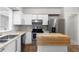 Cozy kitchen with stainless steel appliances, light countertops, and a convenient breakfast bar at 765 Houston Mill Ne Rd # 7, Atlanta, GA 30329
