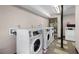 Community laundry room with multiple washing machines and a dryer available for tenant use at 765 Houston Mill Ne Rd # 7, Atlanta, GA 30329