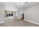 Spacious living room with hardwood floors leads to a sliding glass door and kitchen at 765 Houston Mill Ne Rd # 7, Atlanta, GA 30329