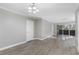 Open floor plan with hardwood floors leading to a door and a sliding glass door at 765 Houston Mill Ne Rd # 7, Atlanta, GA 30329