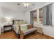 Bright bedroom with hardwood floors, natural light, and comfortable furnishings at 1111 Briarcliff Ne Pl # 2, Atlanta, GA 30306