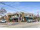 Commercial building exterior with awnings, street-side parking, a modern sign, and a bustling atmosphere at 1111 Briarcliff Ne Pl # 2, Atlanta, GA 30306