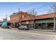 Street view of commercial buildings, including restaurants with outdoor seating and retail storefronts with parking at 1111 Briarcliff Ne Pl # 2, Atlanta, GA 30306
