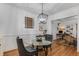 Classic dining room with glass table and hardwood floors at 1111 Briarcliff Ne Pl # 2, Atlanta, GA 30306
