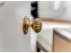 Close up of an ornate gold-colored door knob on a white painted door at 1111 Briarcliff Ne Pl # 2, Atlanta, GA 30306
