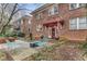 Charming brick apartment building entrance with manicured landscaping and inviting outdoor seating at 1111 Briarcliff Ne Pl # 2, Atlanta, GA 30306