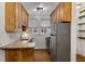 Galley kitchen with wood cabinetry, granite countertops, and stainless steel appliances at 1111 Briarcliff Ne Pl # 2, Atlanta, GA 30306