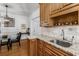 Kitchen featuring wood cabinets, granite counters, and stainless steel sink at 1111 Briarcliff Ne Pl # 2, Atlanta, GA 30306