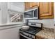 Stainless steel microwave and gas range in a well-lit kitchen at 1111 Briarcliff Ne Pl # 2, Atlanta, GA 30306