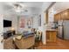 Cozy living room with a ceiling fan, view of the kitchen, and comfortable seating area at 1111 Briarcliff Ne Pl # 2, Atlanta, GA 30306