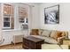 Comfortable living room featuring hardwood floors, natural light, and a cozy seating area at 1111 Briarcliff Ne Pl # 2, Atlanta, GA 30306